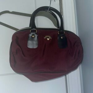 Victoria’s Secret burgundy with black trim and gold hardware cloth handbag!